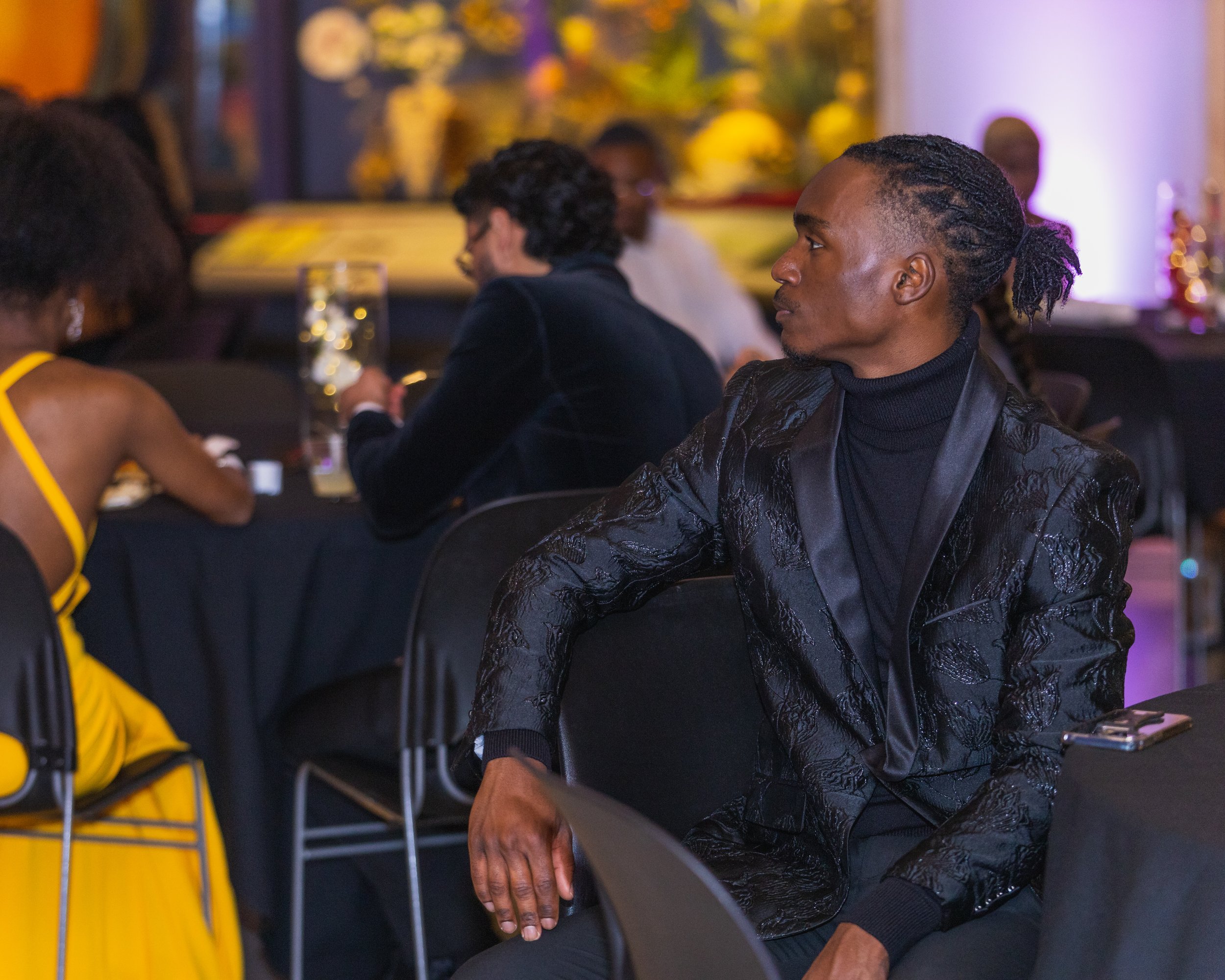 corporate event photography of man engaged with the speaker