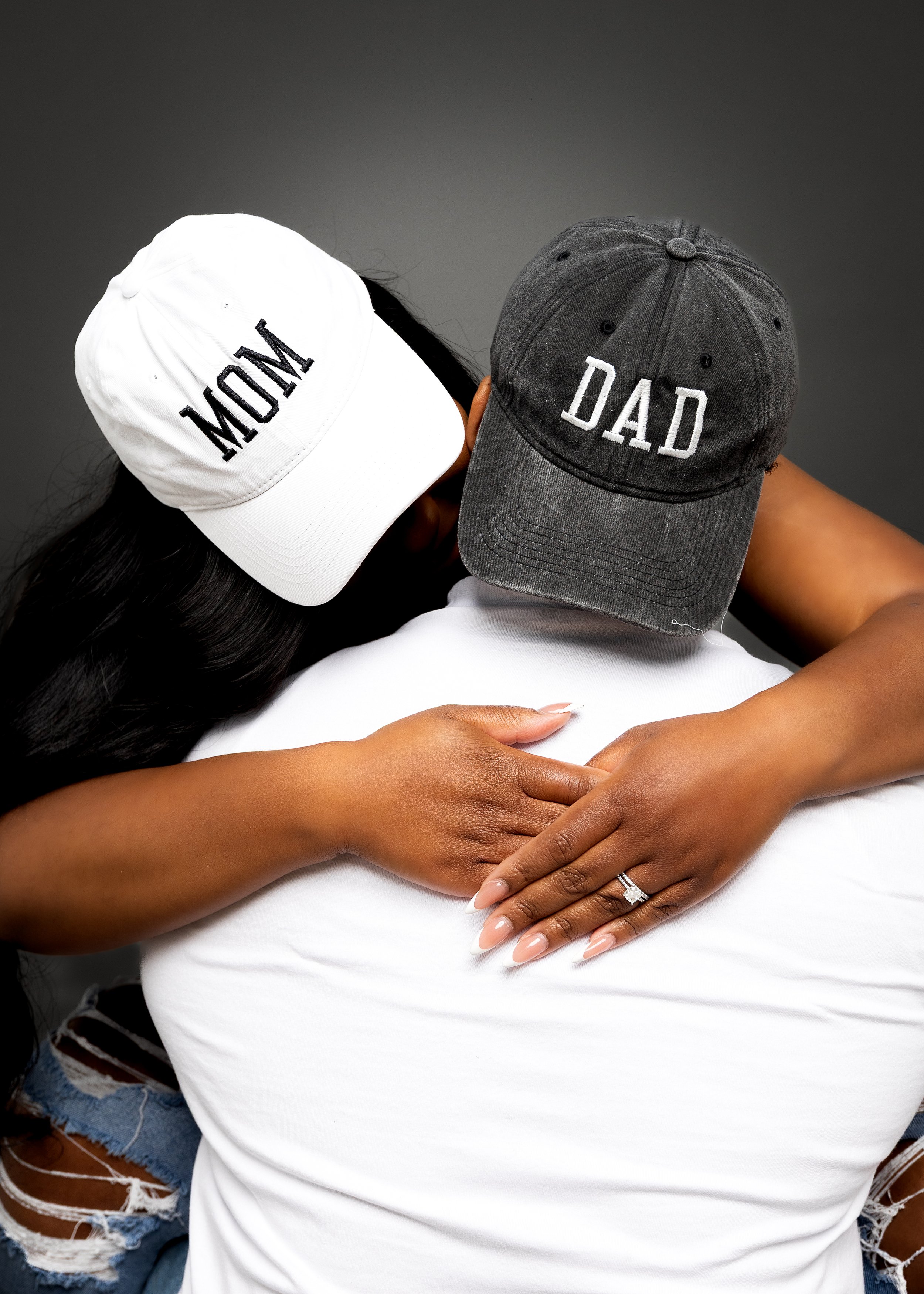Maternity photo with couple with mom & dad hat