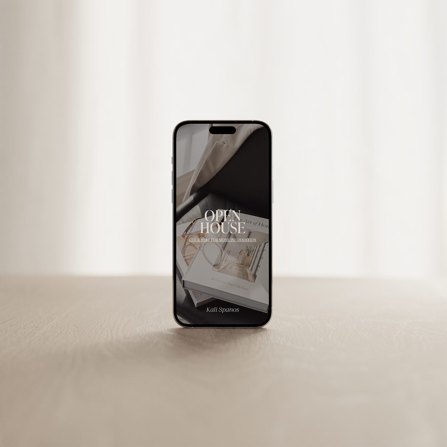 Smartphone displaying an open house event advertisement with an interior home decor photo and text 'Open House' on a plain background.