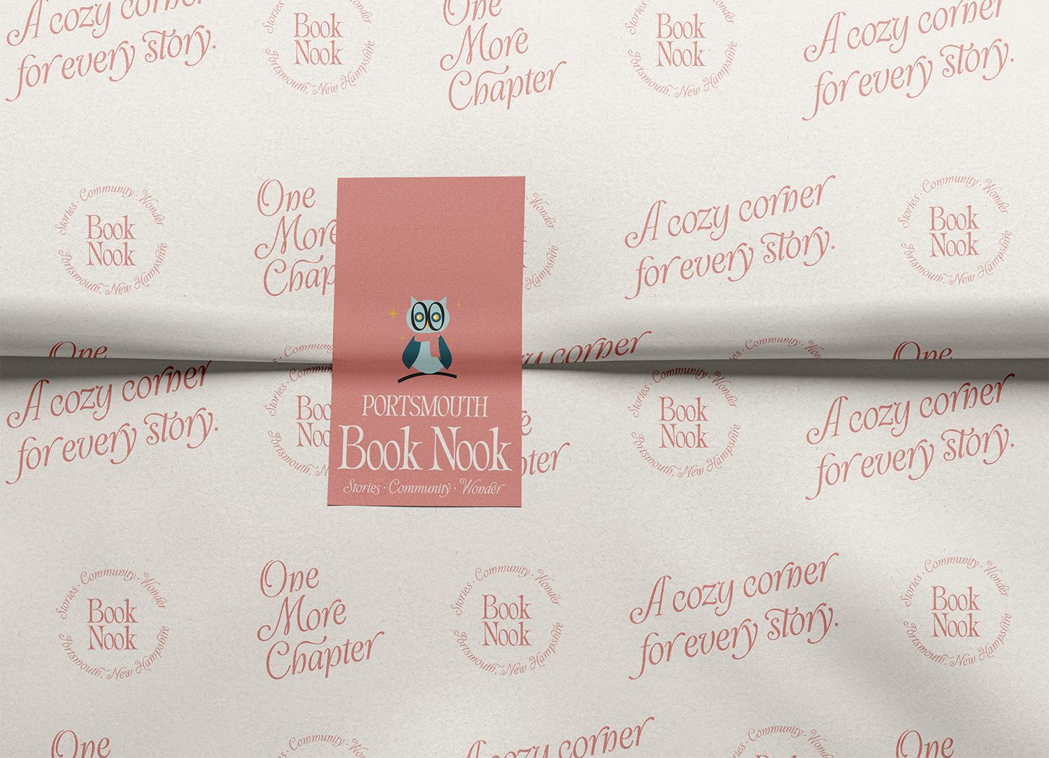A promotional paper with a background pattern of the phrases "A cozy corner for every story," and "Stories. Community. Wonder," along with a circular logo that reads "Book Nook, Portsmouth, New Hampshire." In the center, there is a pink rectangle wit