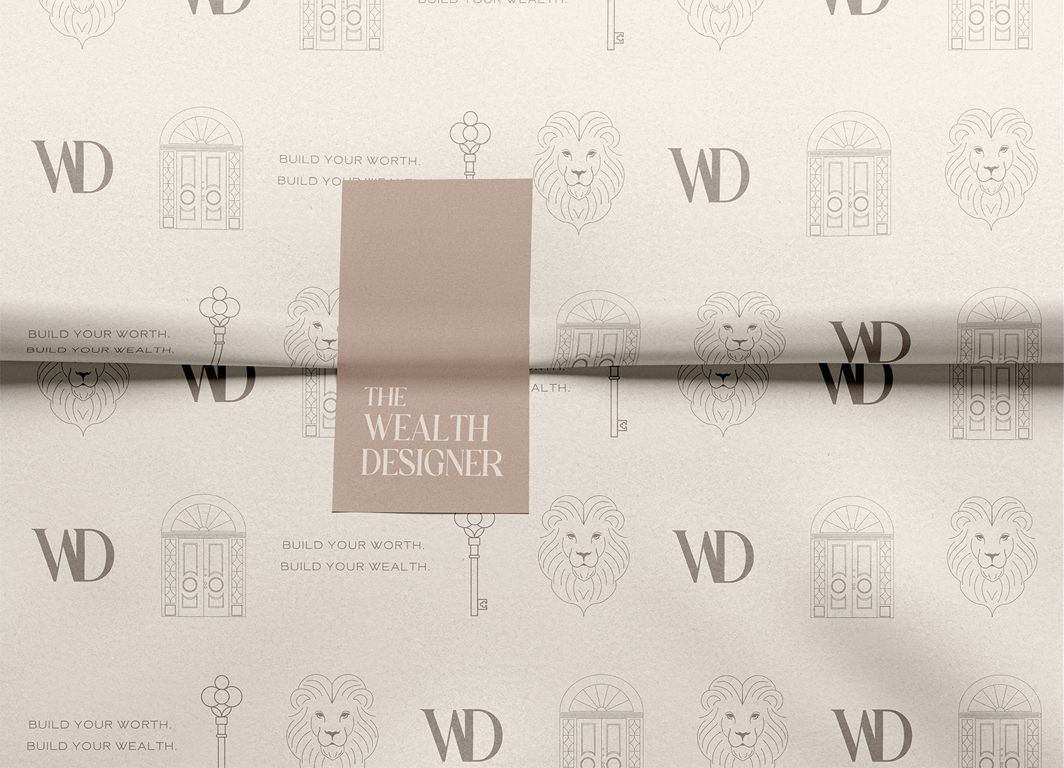 A beige textured paper with a repeating pattern of a lion's face, a door with arch window, a key, and the letters 'WD'. In the center, there is a taupe rectangle with the text 'The Wealth Designer' in white.