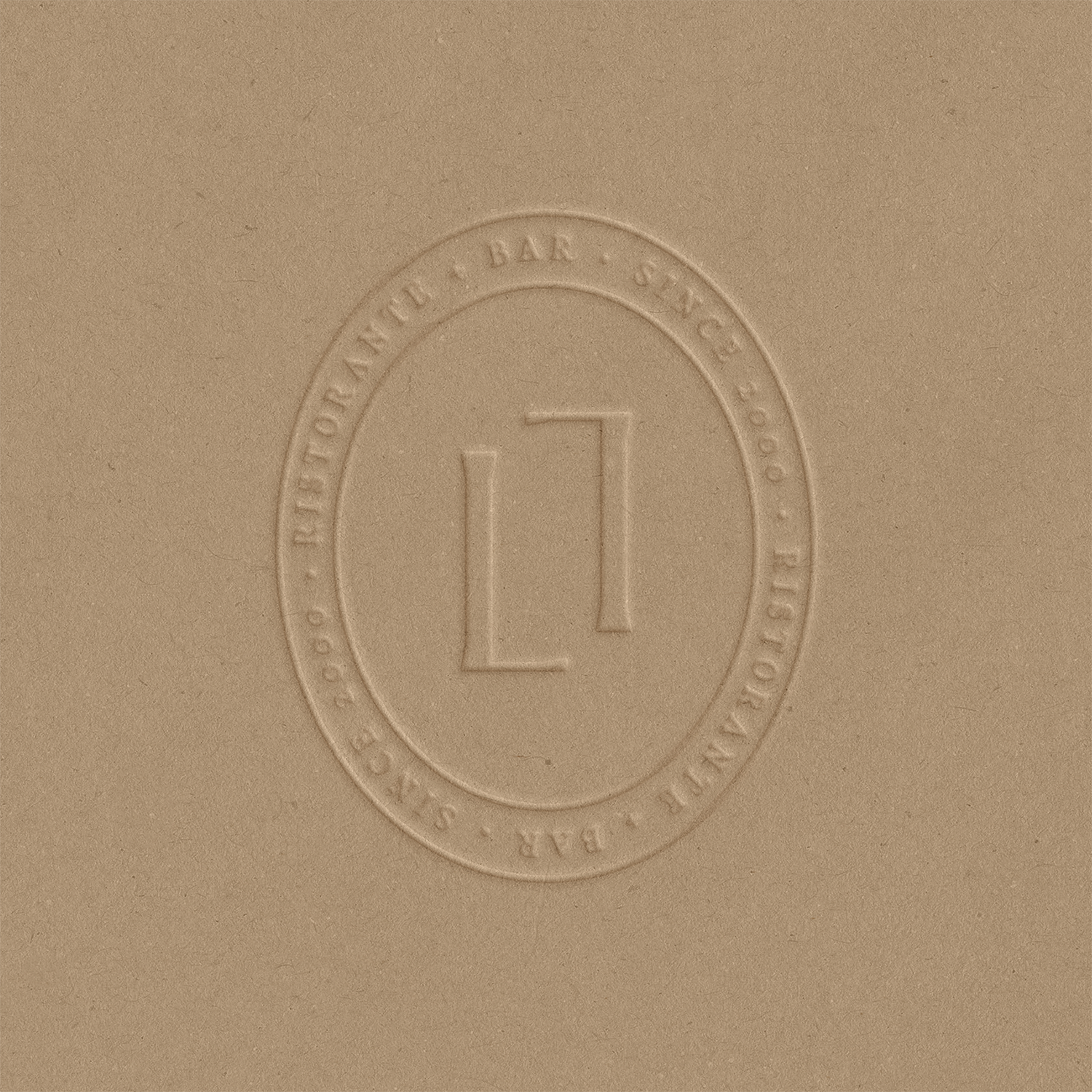 Close-up of a beige surface with an embossed circular seal that says 'Sangem-station, top, bottom, right, left' around the number 1 in the center.