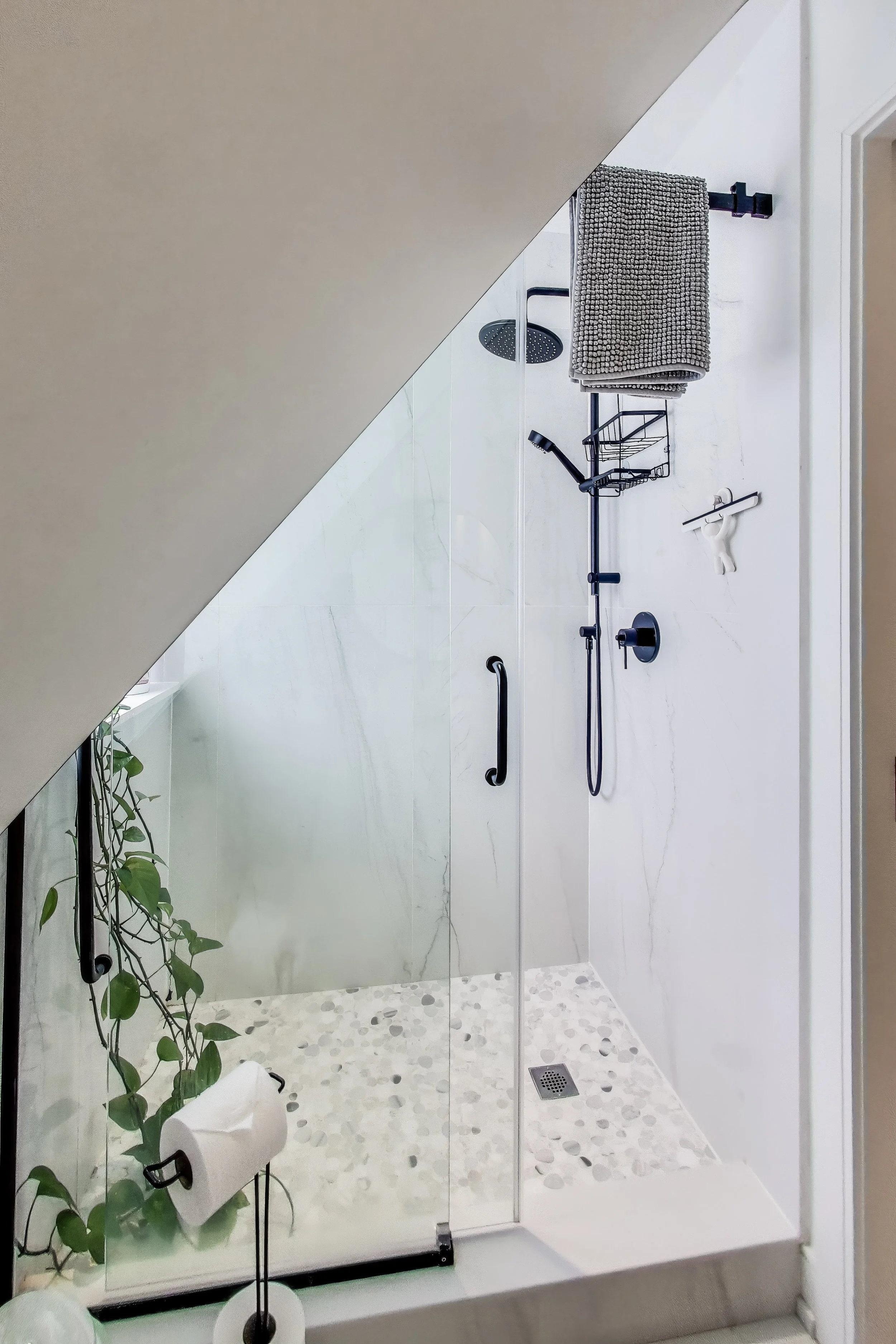 Modern shower in Muskoka A-frame cottage featuring sleek design and refreshing water pressure — perfect for unwinding after a day of outdoor activities in Ontario’s cottage country.