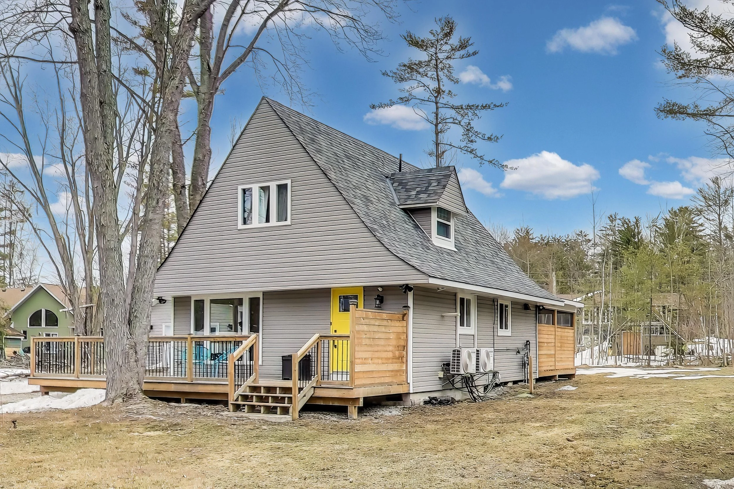 Scenic A-frame cottage in Muskoka, Ontario nestled among trees with shared lake access and a rustic-modern design — perfect for nature lovers, families, or golf getaways in Ontario’s cottage country.
