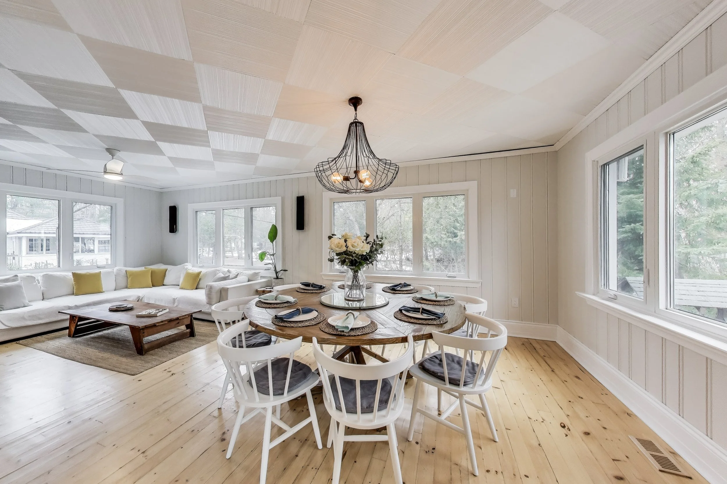 Inviting dining room, featuring cozy seating and a modern design—perfect for relaxing after a day of golf, enjoying lakefront views, or unwinding in Ontario's beautiful cottage country.