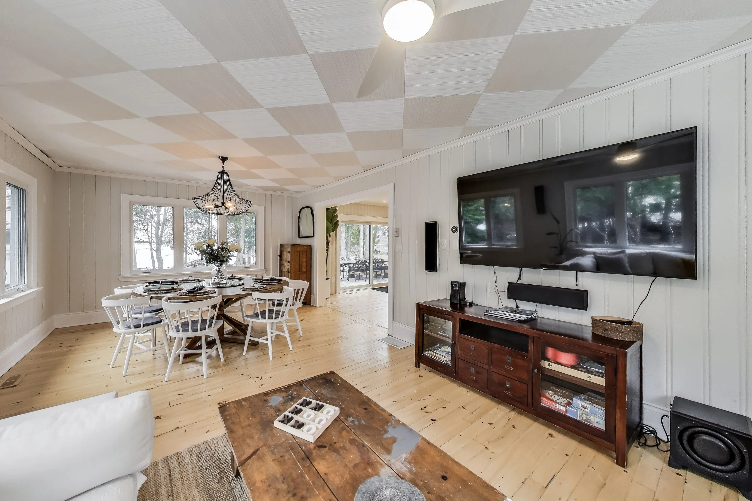 Inviting living room, featuring cozy seating and a modern design—perfect for relaxing after a day of golf, enjoying lakefront views, or unwinding in Ontario's beautiful cottage country.