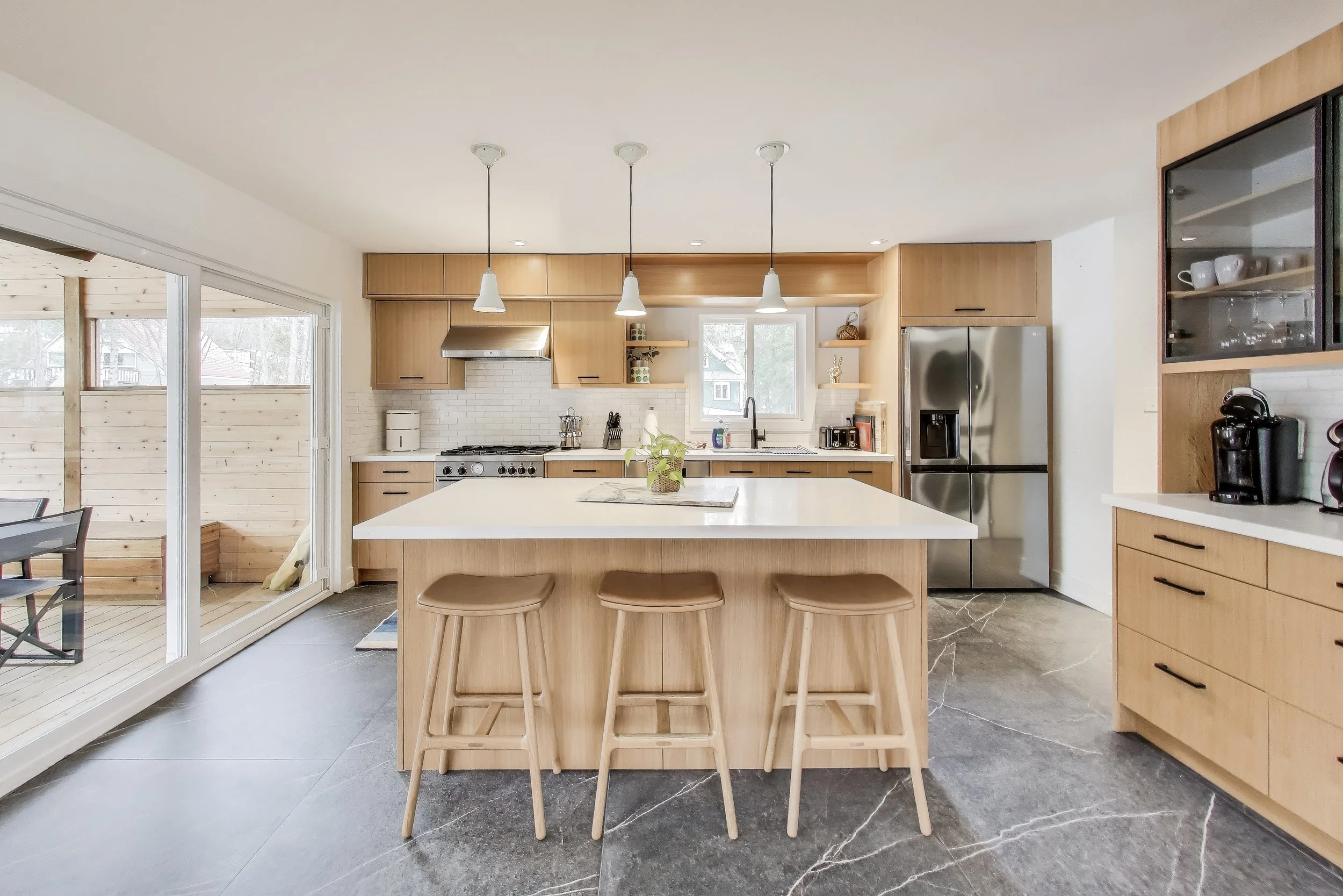 Fully equipped kitchen in Muskoka A-frame cottage with modern appliances, spacious countertops, and everything you need to cook and entertain while enjoying lakefront living in Ontario’s cottage country.
