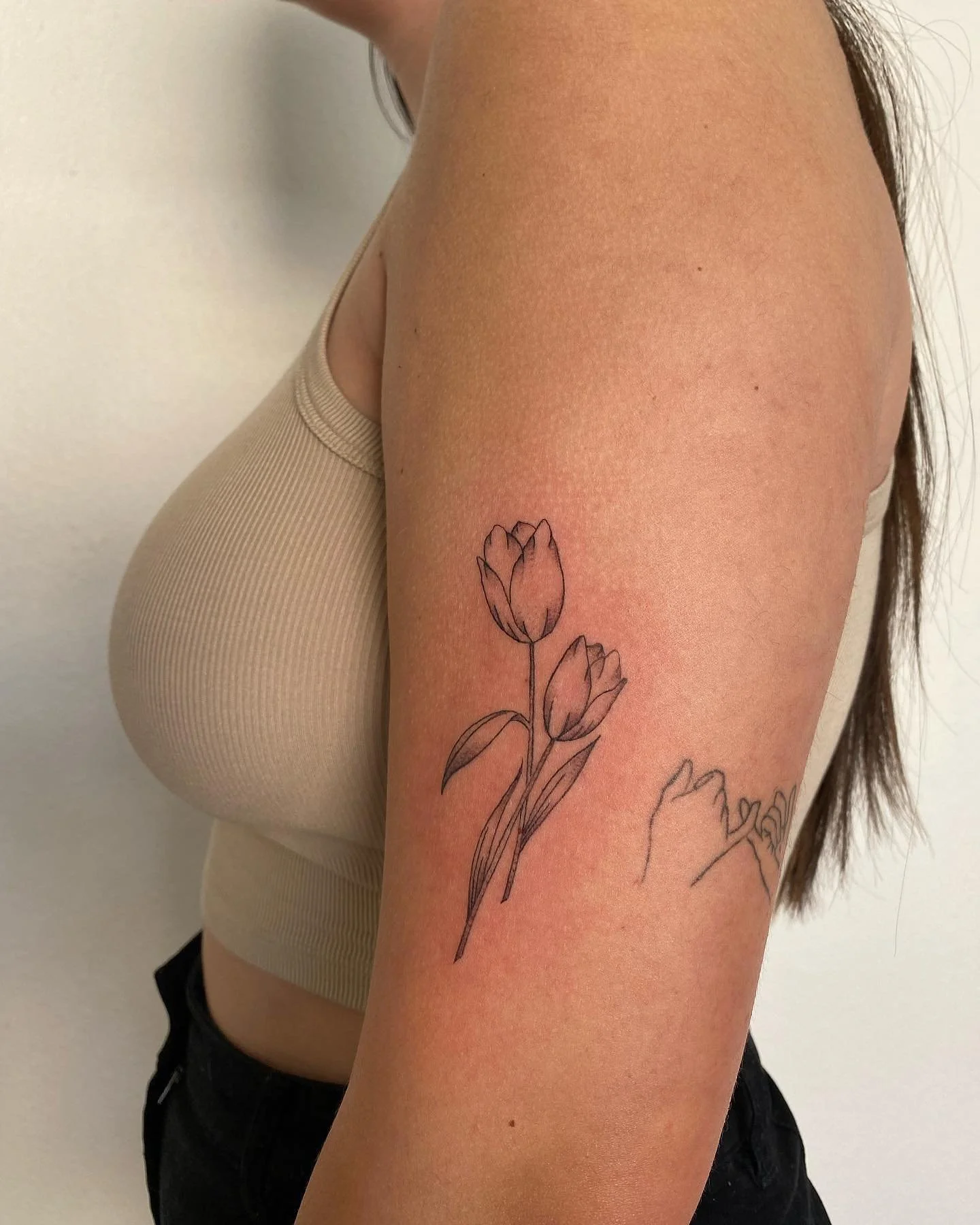 Matching mother &amp; daughter tulip tattoos 🌷 done by @sharkattacked 

June tattoo appointments can be booked online 🌿