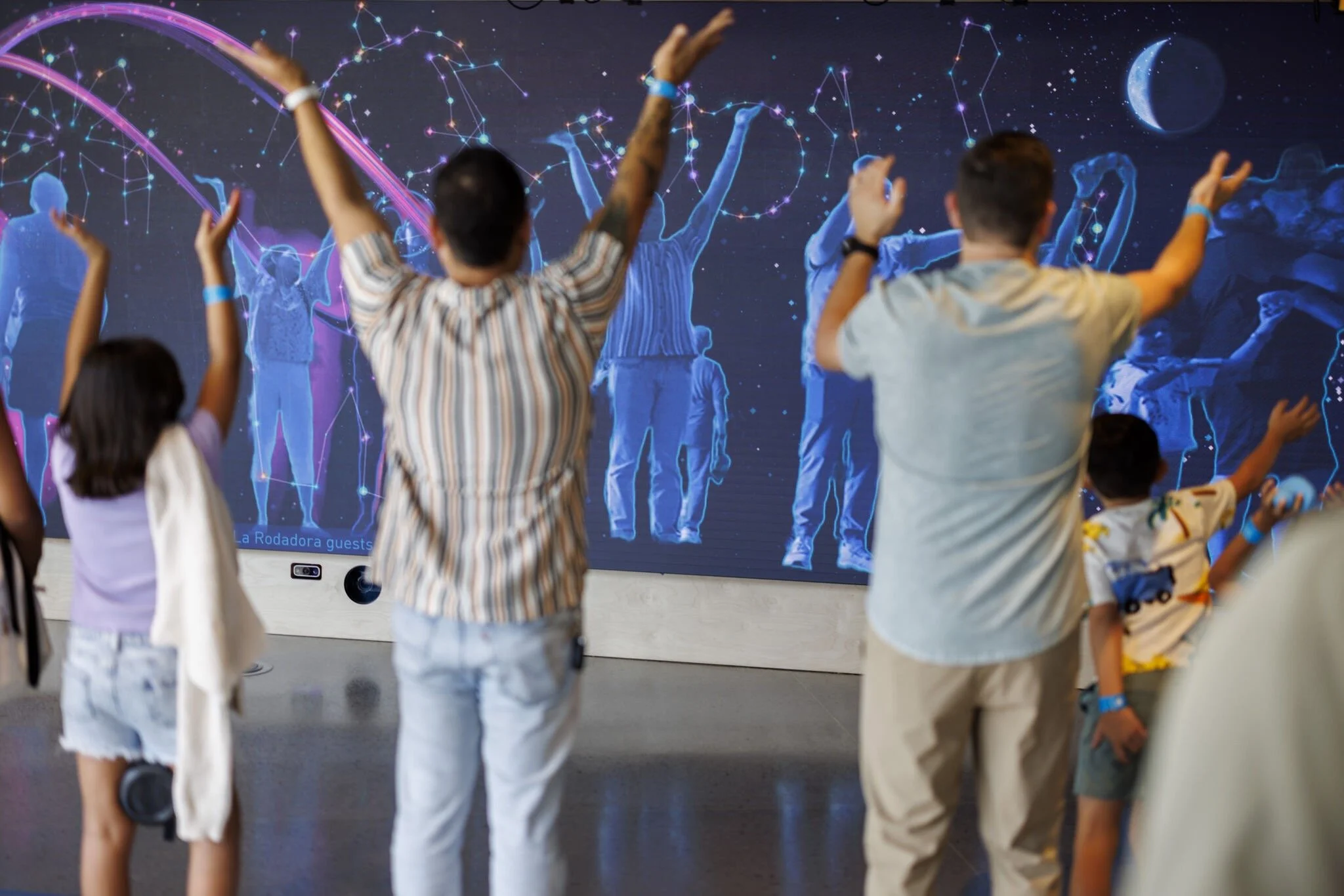 Crowd with arms up.jpg