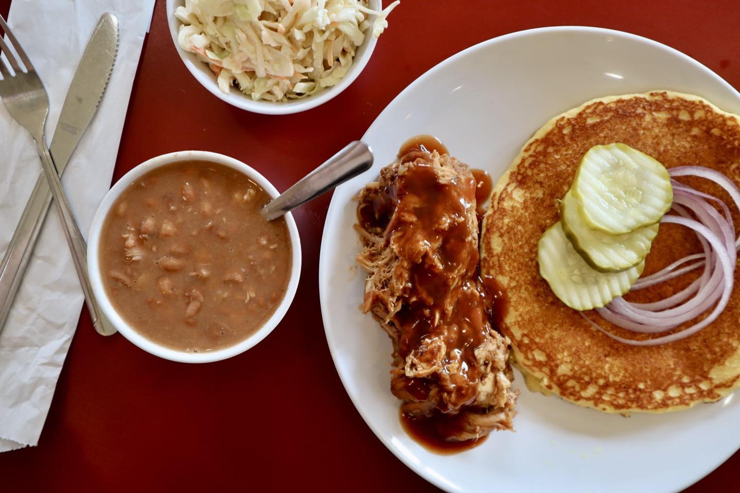 One of our favorite ways to show off Kentucky &mdash; the Stone Cross Farm Pulled Pork Plate.  Smoked and pulled local pork, house made bourbon bbq sauce, hoe cake made with locally grown &amp; ground corn, Whitesburg soup beans &amp; a creamy slaw!
