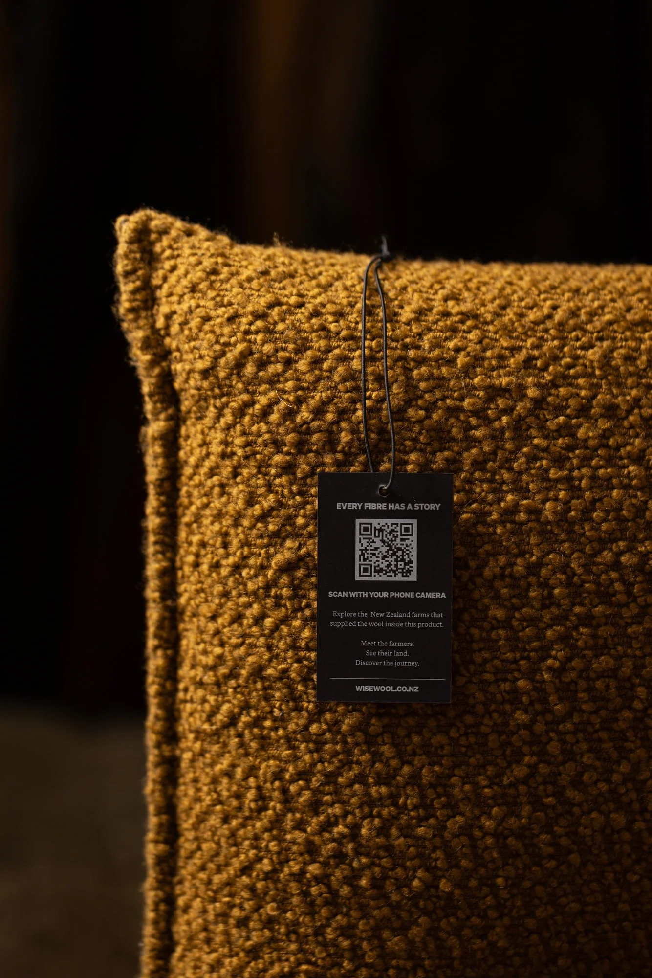 100% wool couch filled with Wiselayer™ and Wisefill™, showcasing the Wisewool™ Traceability Programme with the QR code tracing the wool back to farm.