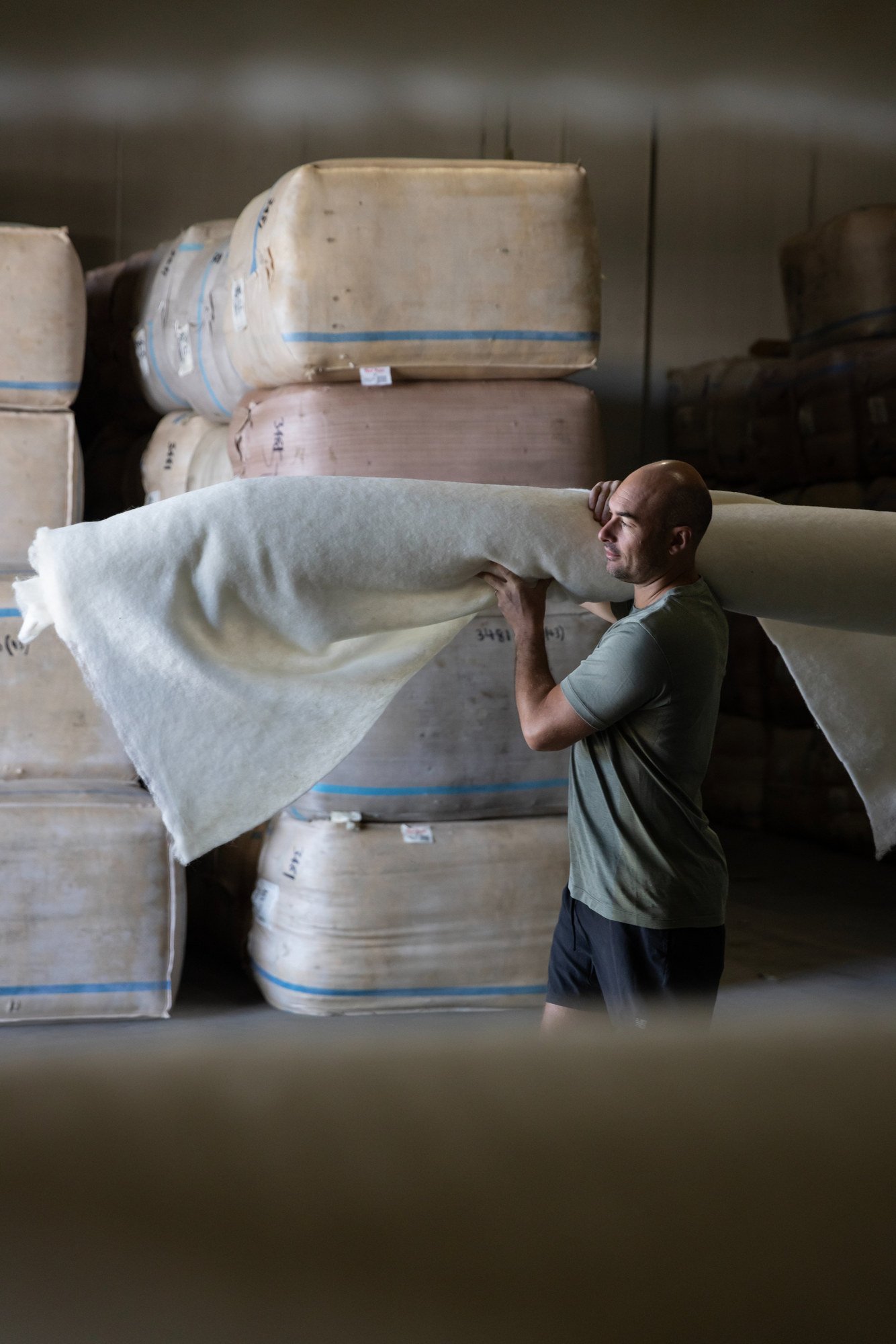 Harry Urquhart-Hay carrying a roll of Wiselayer™ blanketing