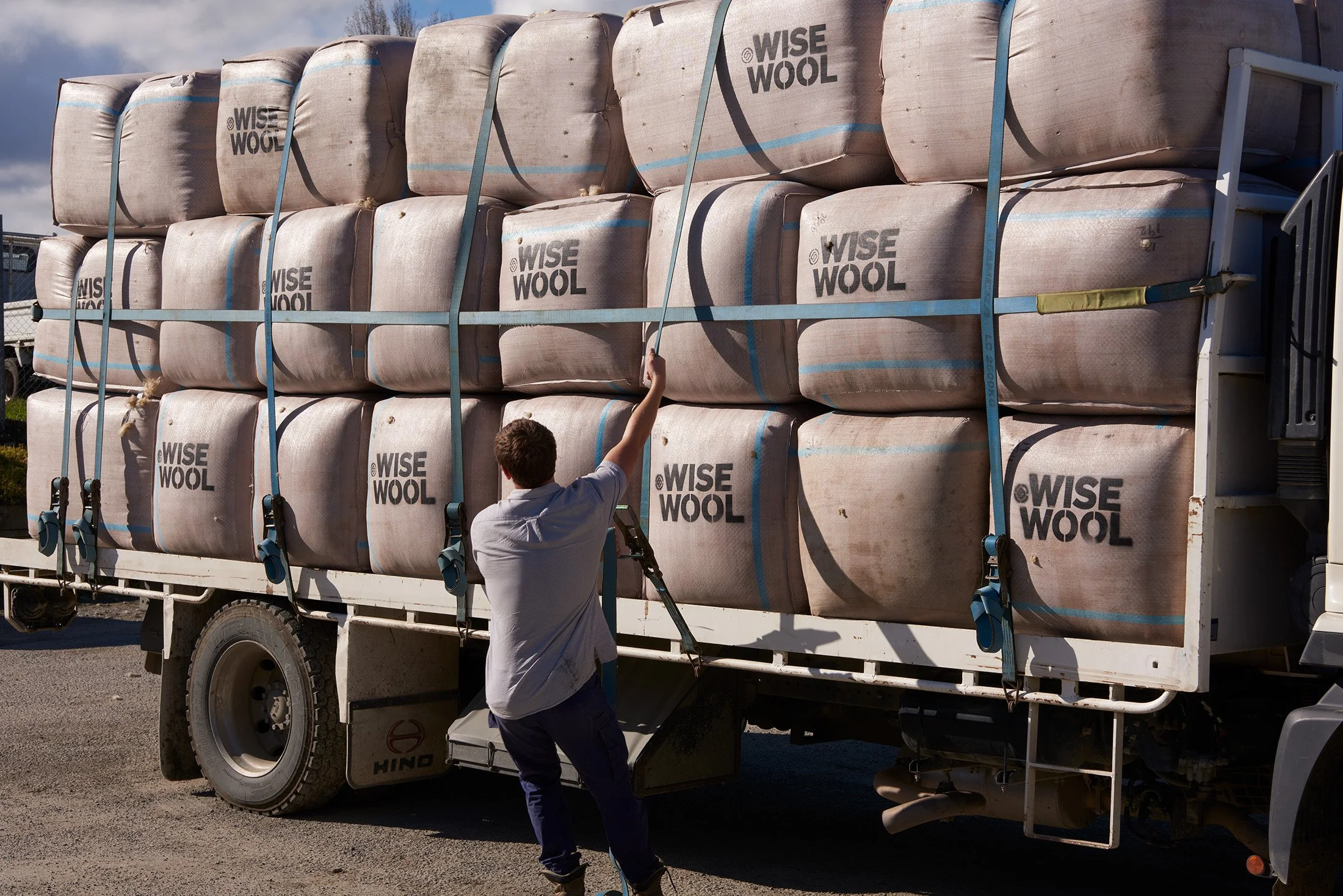 Wool bales being loaded onto a truck bound for the Wisewool™ factory for processing.