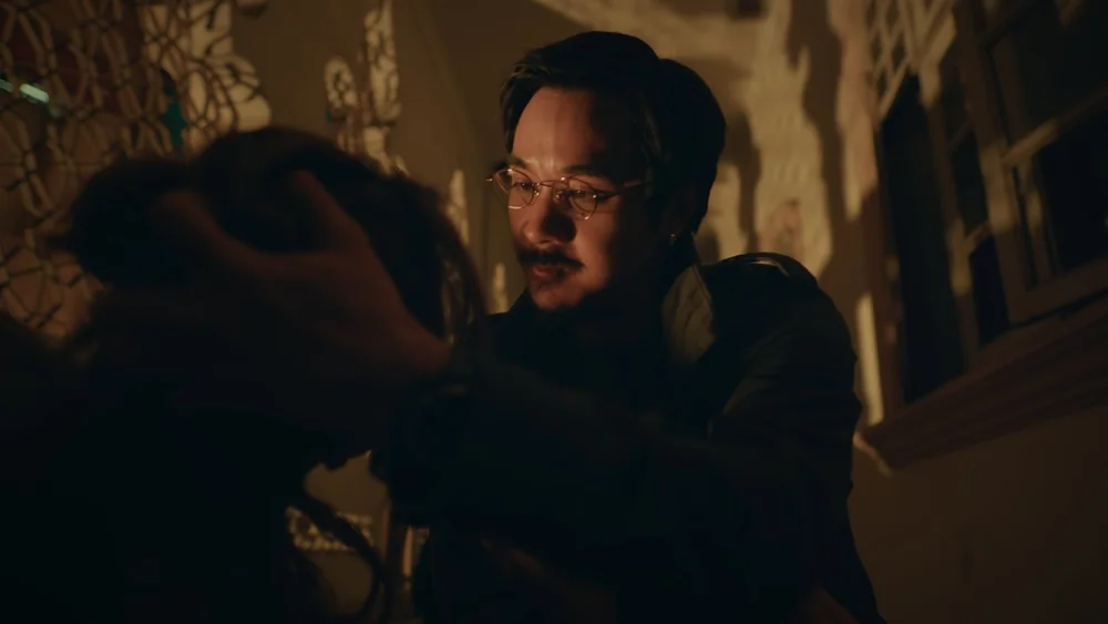 Character close-up in warm amber light, from One Cent Thief Episode 8