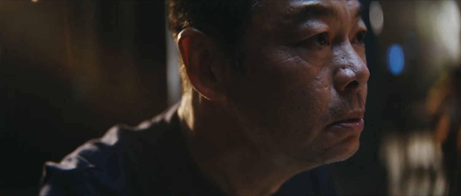 Close-up of the father in the Toyota night-time conversation