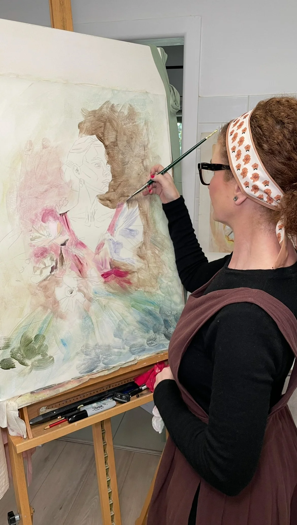 fine artist joanna blair painting the underlayers of her painting titled The Beginning of Her Becoming