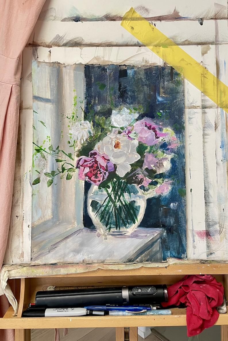 Work in progress studio view of For Her Beauty Within by Joanna Blair, showing a floral still life painting on the easel as part of The Beginning of Her Becoming series. The piece explores beauty, self-recognition, and the quiet inner victories a wom