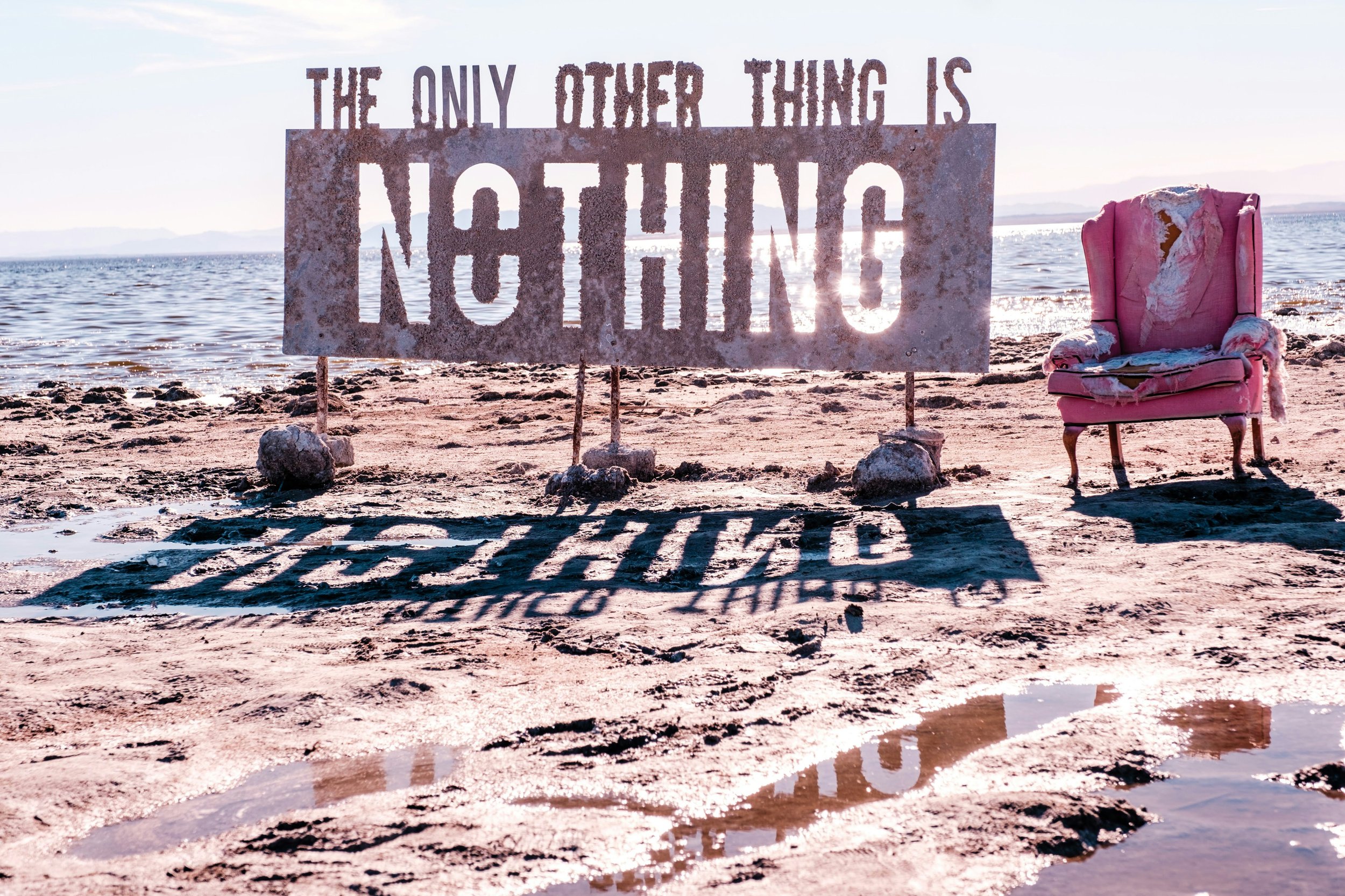 A sign in the desert that reads - the only other thing is nothing.