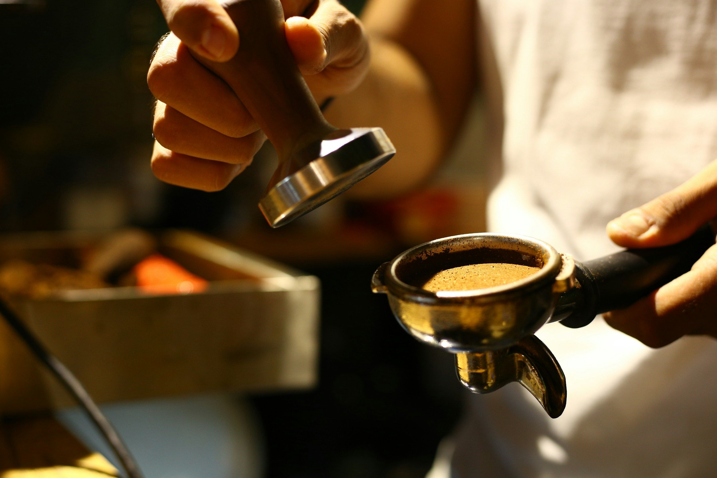 Barista using coffee grounds in Melbourne best coffee shop