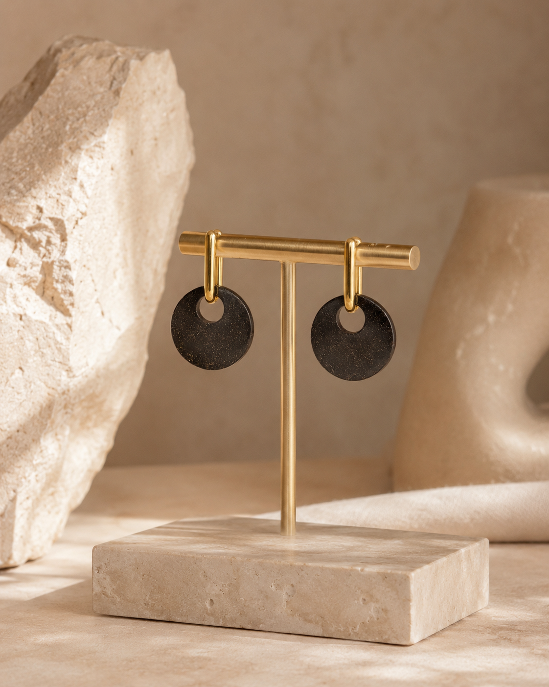 Lou recycled coffee disc earrings with 18K gold-plated findings, displayed on a white Atelier Cayelle product card against a warm neutral background.