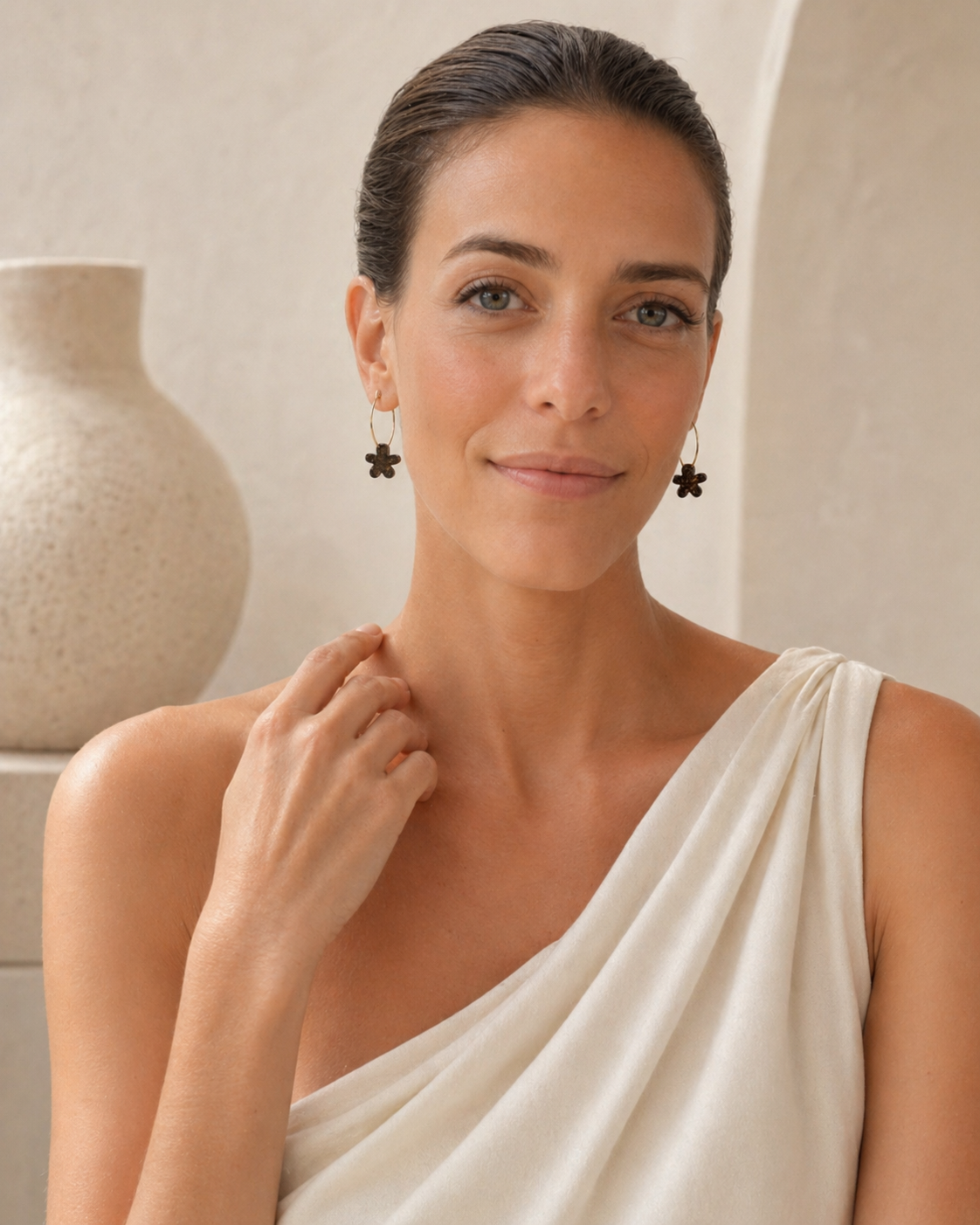 Front portrait of woman wearing black flower hoop earrings, lightweight handmade jewellery made in Melbourne