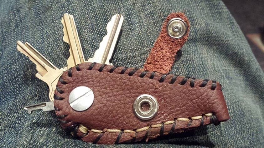 A key holder made to work like a pocket knife (open).