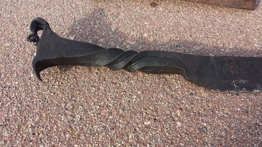 A "dragon head" rail road spike knife auctioned for charity