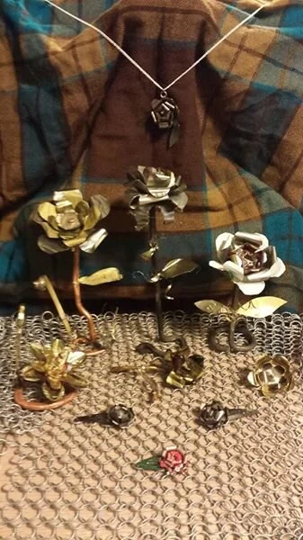 Metal flowers made of soup-can lids and bottle caps