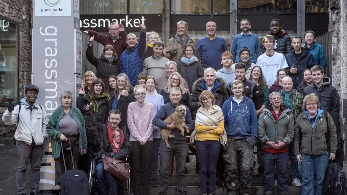 Staff and members stand outside Grassmarket Community Project in Edinburgh.