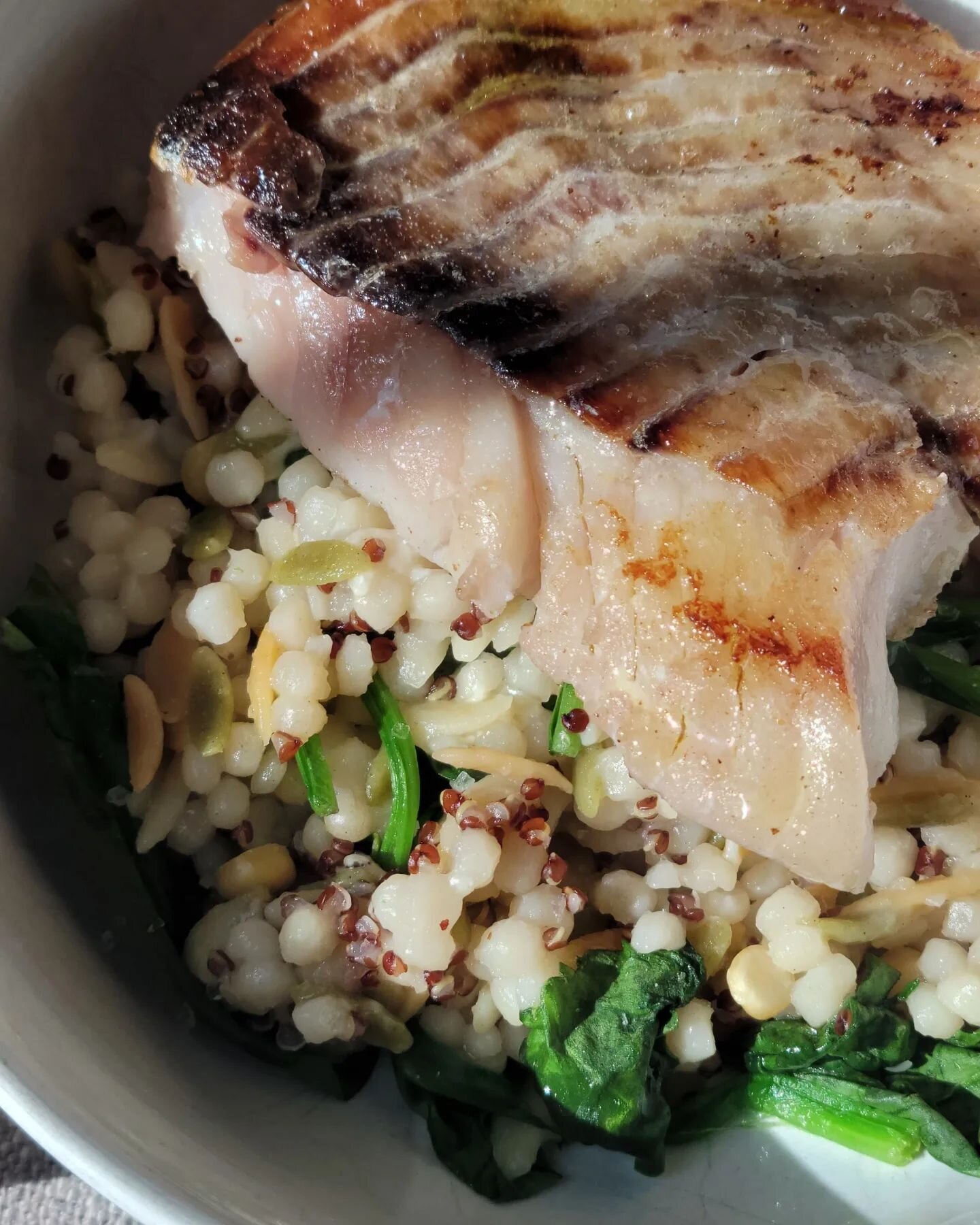 A dinner of firsts. 

I tried this harvest blend from Trader Joe's. It's couscous, orzo, split baby garbanzo beans &amp; red quinoa. Now the texture is an adjustment, but I like it. I mixed in spinach, &amp; seasoned with salt &amp; pepper. 

On top,