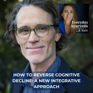 A book cover featuring a middle-aged man with glasses and dark hair, and a woman with long brown hair on a smaller inset. The cover's title reads 'How to Reverse Cognitive Decline: A New Integrative Approach' and includes the subtitle 'Everyday Ayurveda with Kate.'