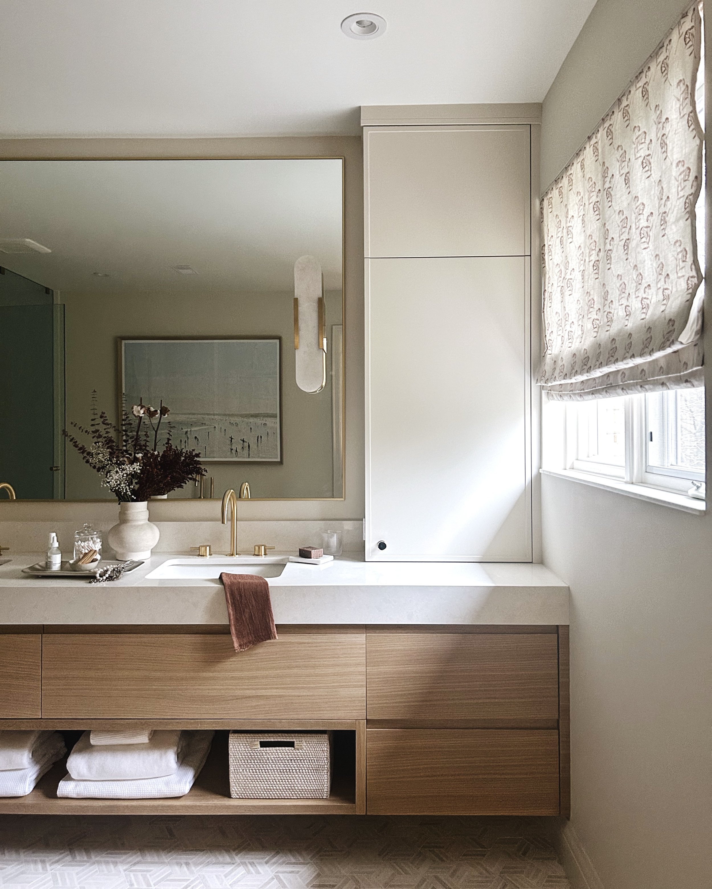Bathroom design, white oak vanity, double vanity, marble tile, brass faucet, floral blind