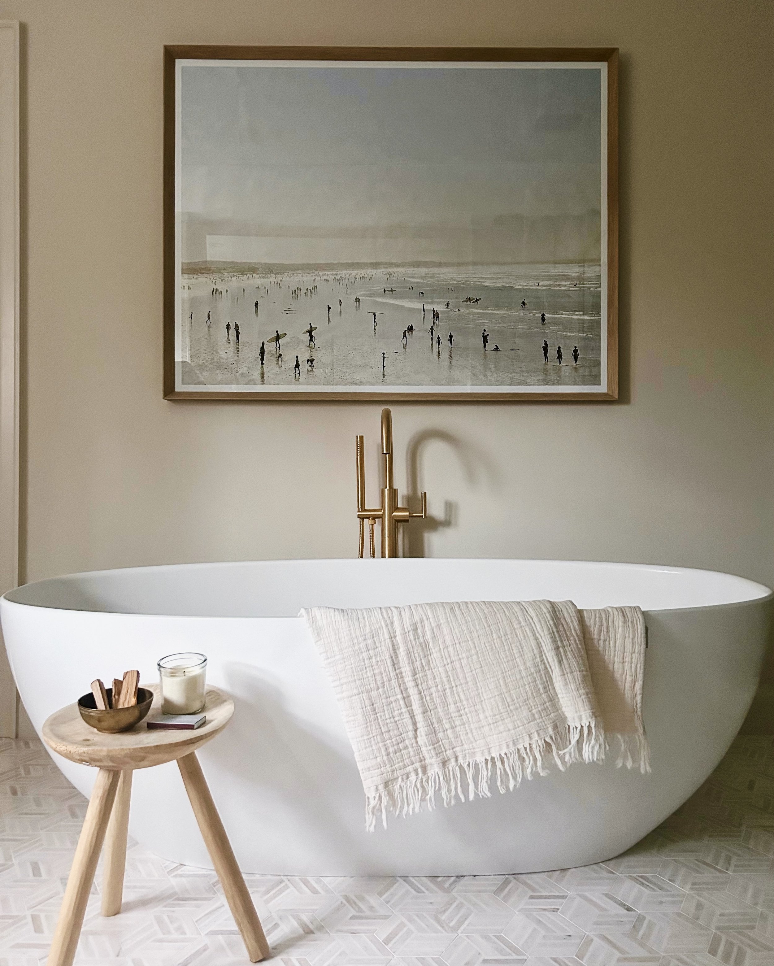 Bathroom design, white oak vanity, double vanity, marble tile, brass faucet, soaker tub, vintage stool