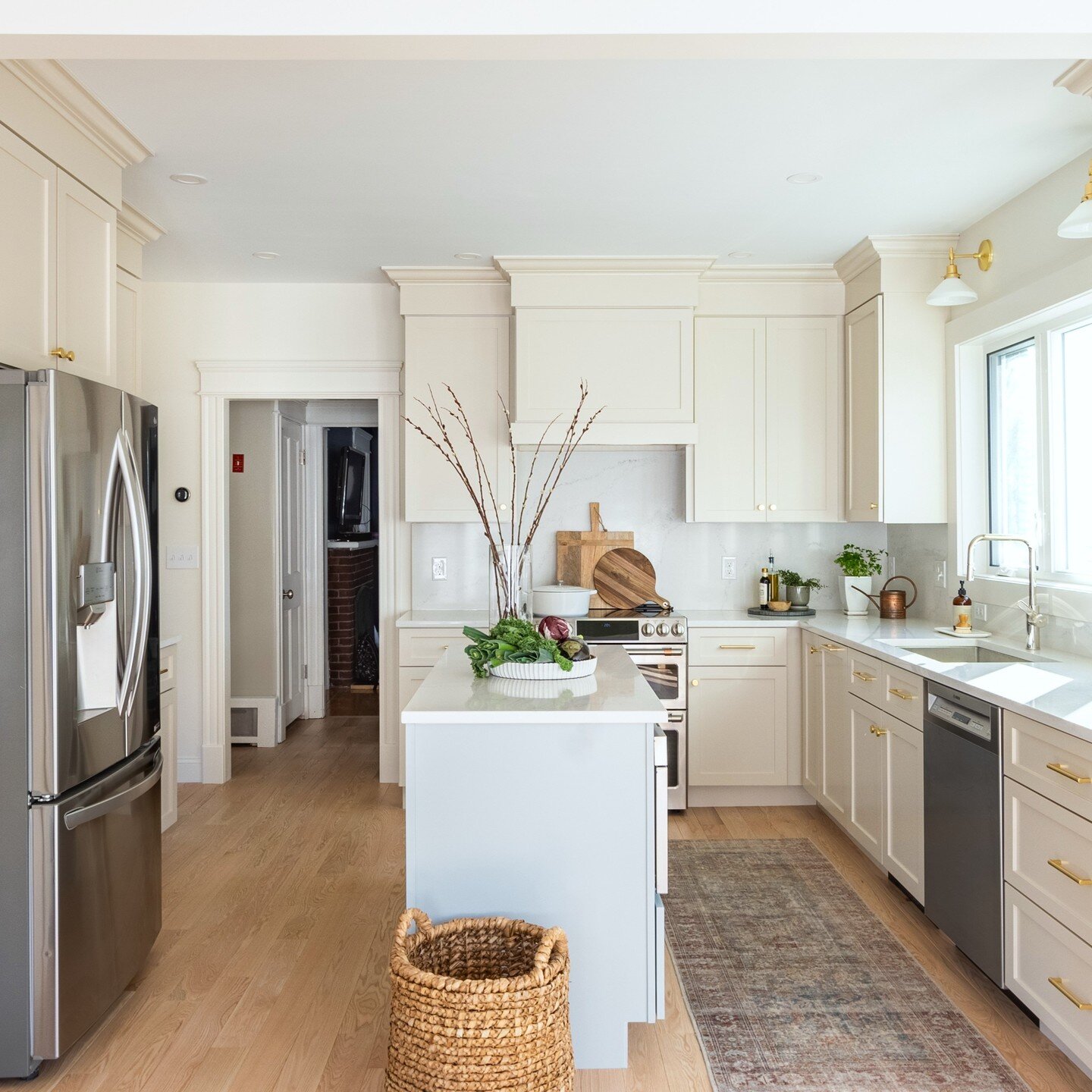 From chaotic and crowded to light, airy, and simplified. A soft palette and a few more feet of space (we raised the ceiling, pushed back the wall behind the fridge, and went for a much larger window) gave this kitchen new life. It's now a space that'