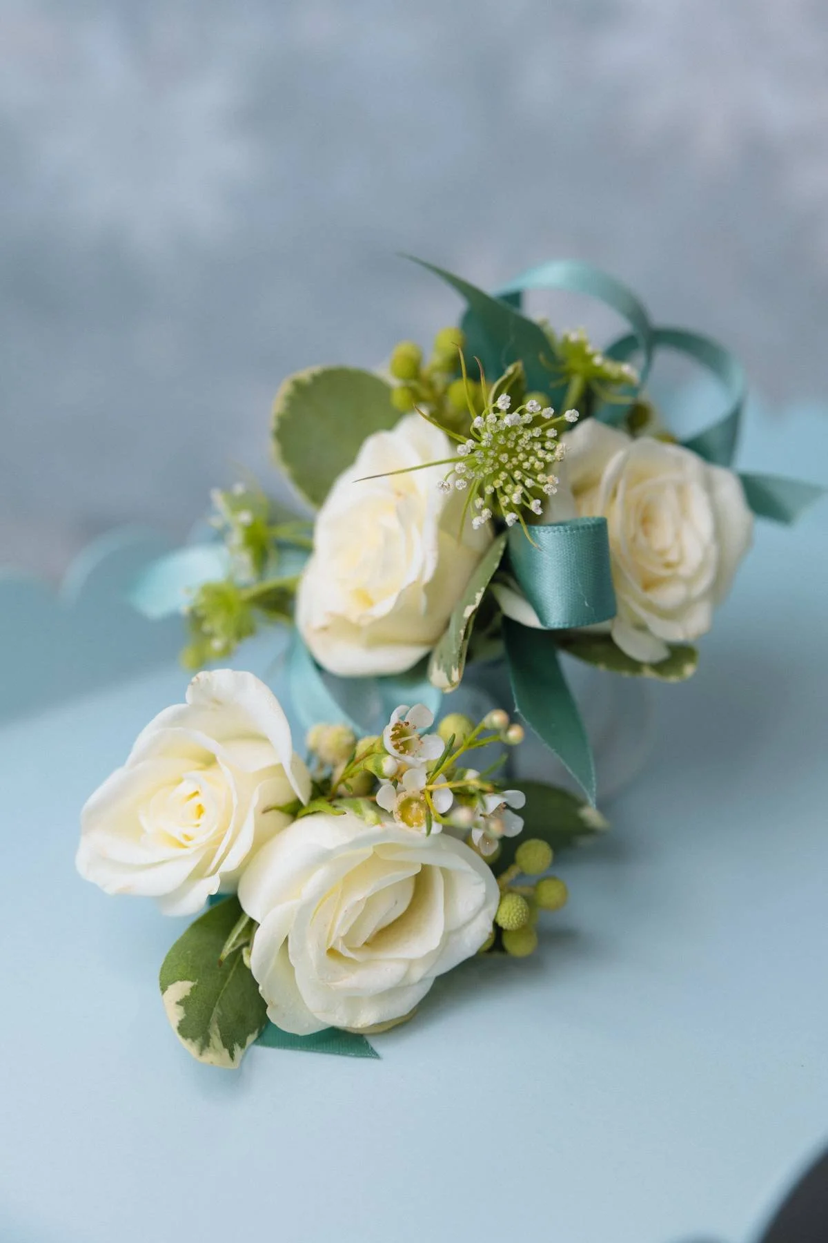 This is a matching corsage and boutonniere for a dance in the spring.