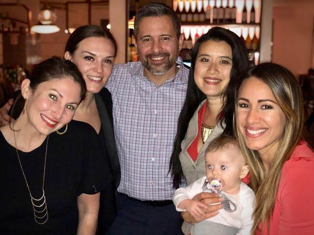 6-month old Dasha with my work family after one of our major press events