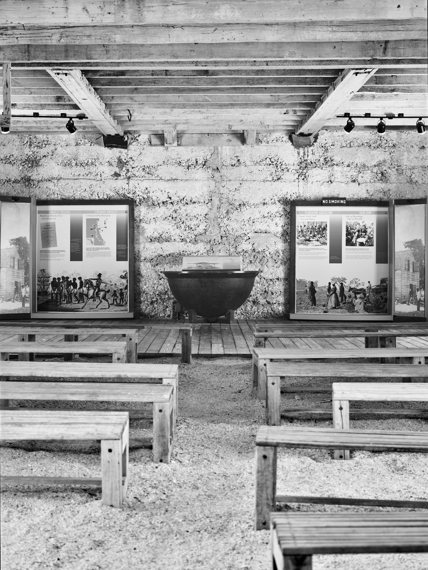Infrared barn interior with display panels, sugar-boiling kettle, benches, Kingsley Plantation, Florida. Phase One Achromatic
