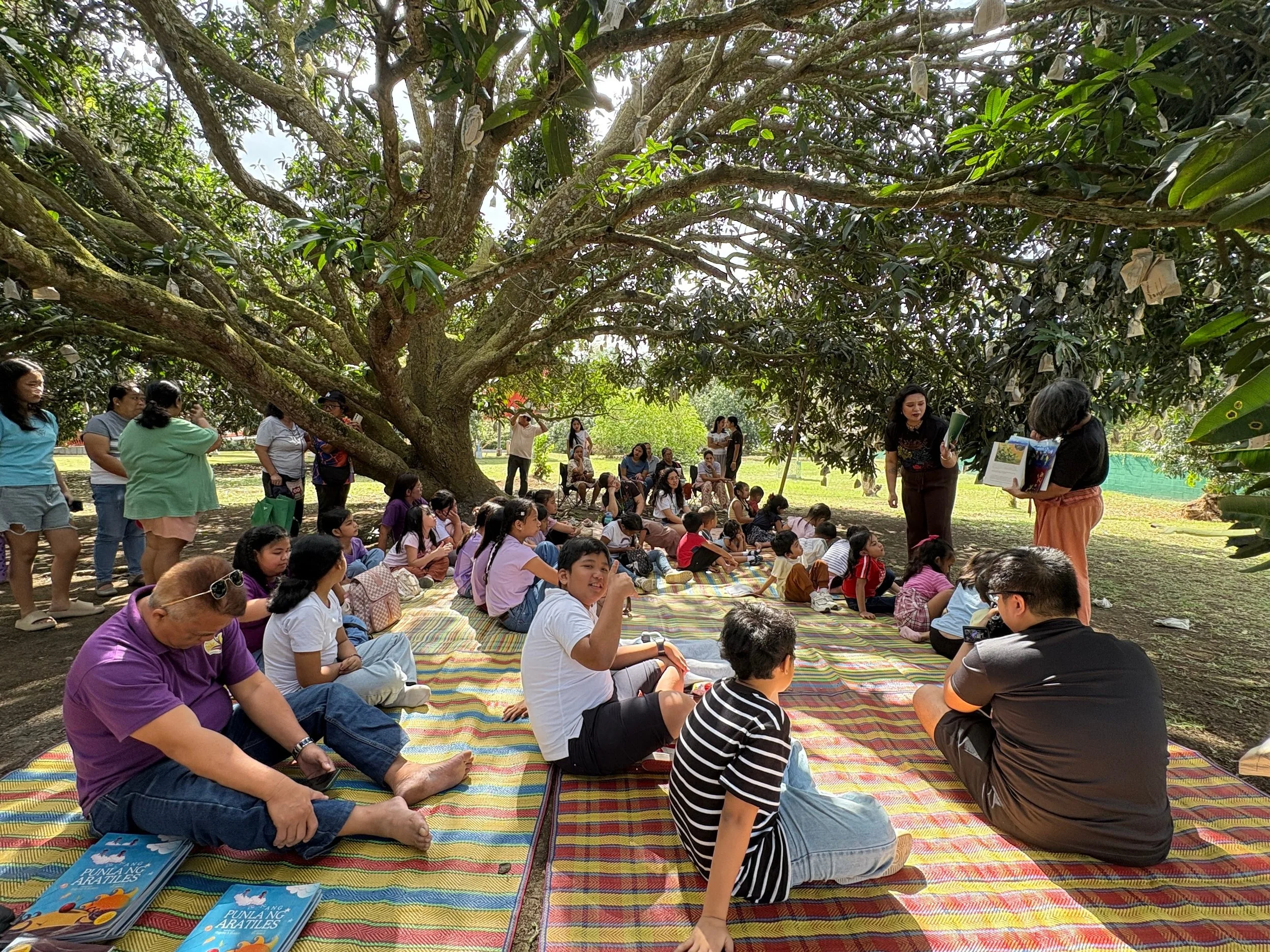 Retelling the story of “Elias and His Trees” to children from nearby Ibaan barangays