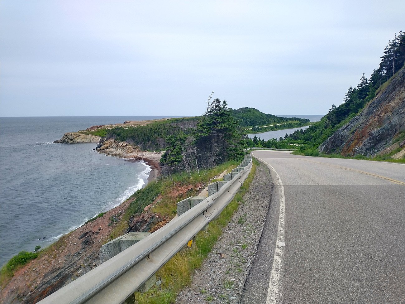 You don't see much going up but then descend with these insane views of the road winding through jagged cliffs and coastlines. Easy top 10 roads in Canada.