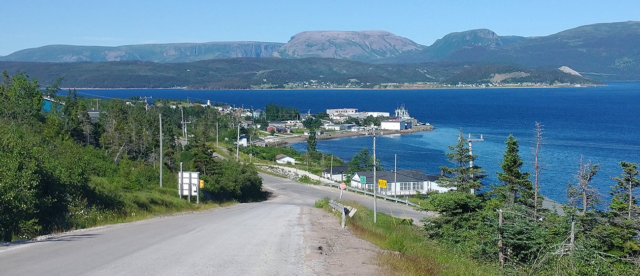 A last look back at Woody Point. You could afford a place here! You'd have a boat, a pickup truck and a dirt bike. What a life you'd have.