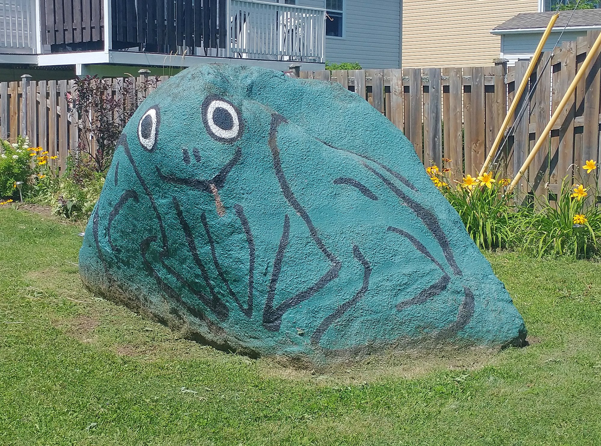 Sometimes people paint funny things on big rocks on their property or even the roads. This is a particularly good one.