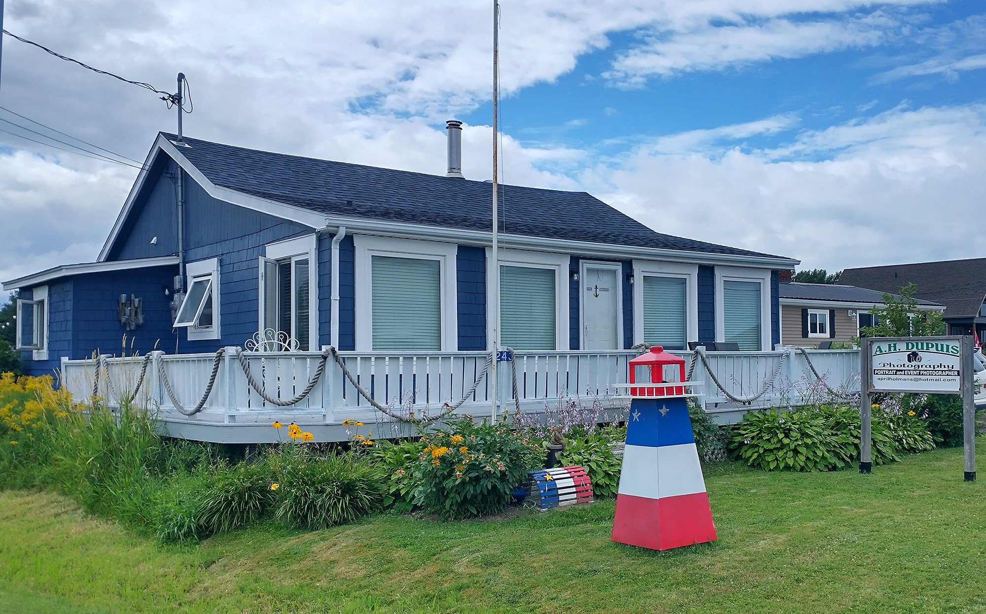 Lot of pretty colorful homes with the nautical themes and those lighthouse lamps.