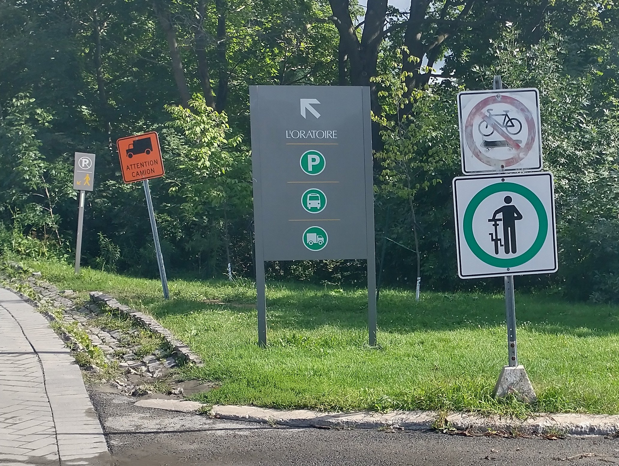 This confusing bike signage courtesy of the one guy who got hit by a bus going downhill while training here...