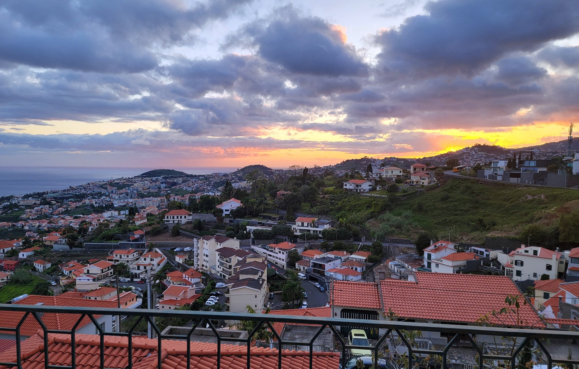 A shuttle can drop you in Funchal for just 6 euro. The sunset from my Airbnb, 300m up from sea level. Total travel time was over 20 hours.