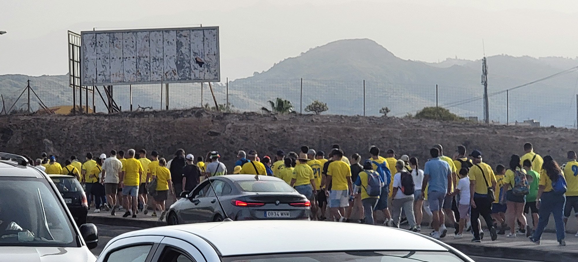 Stuck in socc...er FUTBOL traffic while going back to Las Palmas city center. There were thousands of these yellow shirt people, it was crazy.