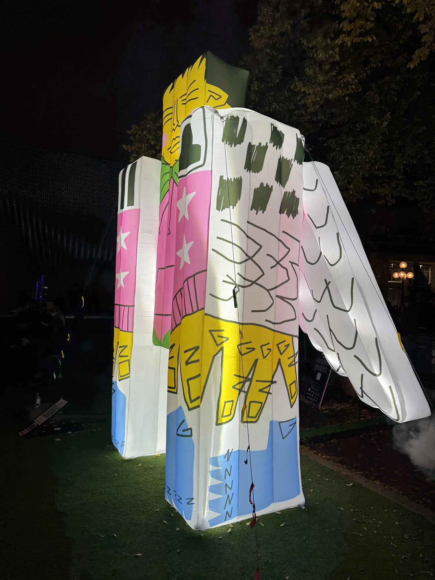 Pink character · illuminated at night