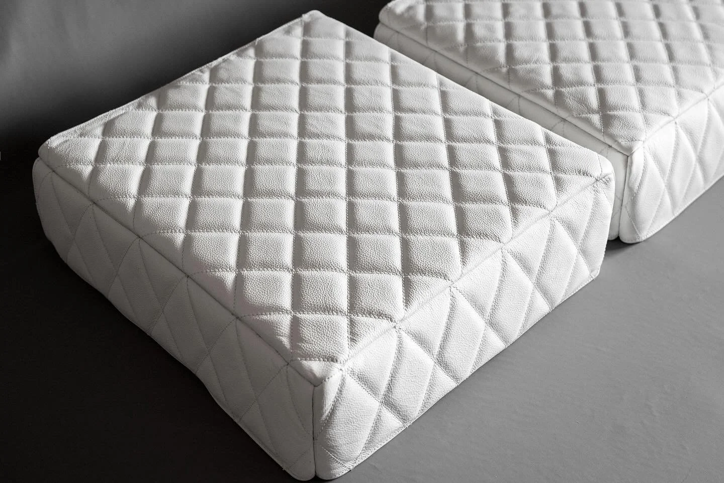 This project included matching diamond stitched white leather covers for an amplifier and Blu-ray player. Also incorporating plastic panels and high density foam.
The visual effect of all matching components really is superb. 
See following posts for