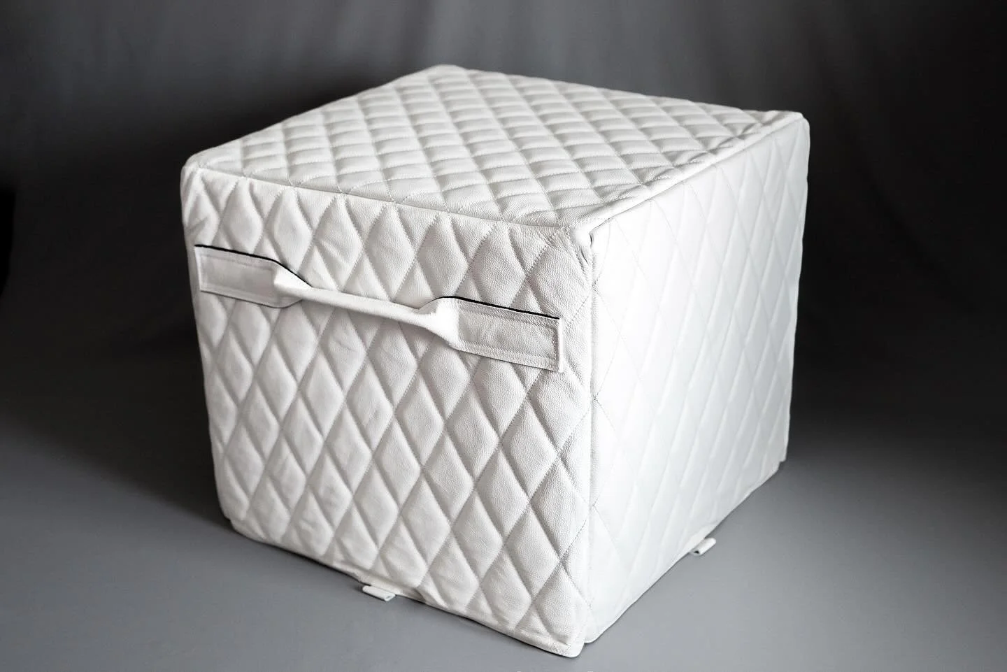 The subwoofer cover, for a @relacoustics T/9x, is the same spec as the floorstanding speakers of the same project, albeit in white leather as opposed to black.
Solid plastic panels, one inch proprietary high density foam, custom leather handles, micr