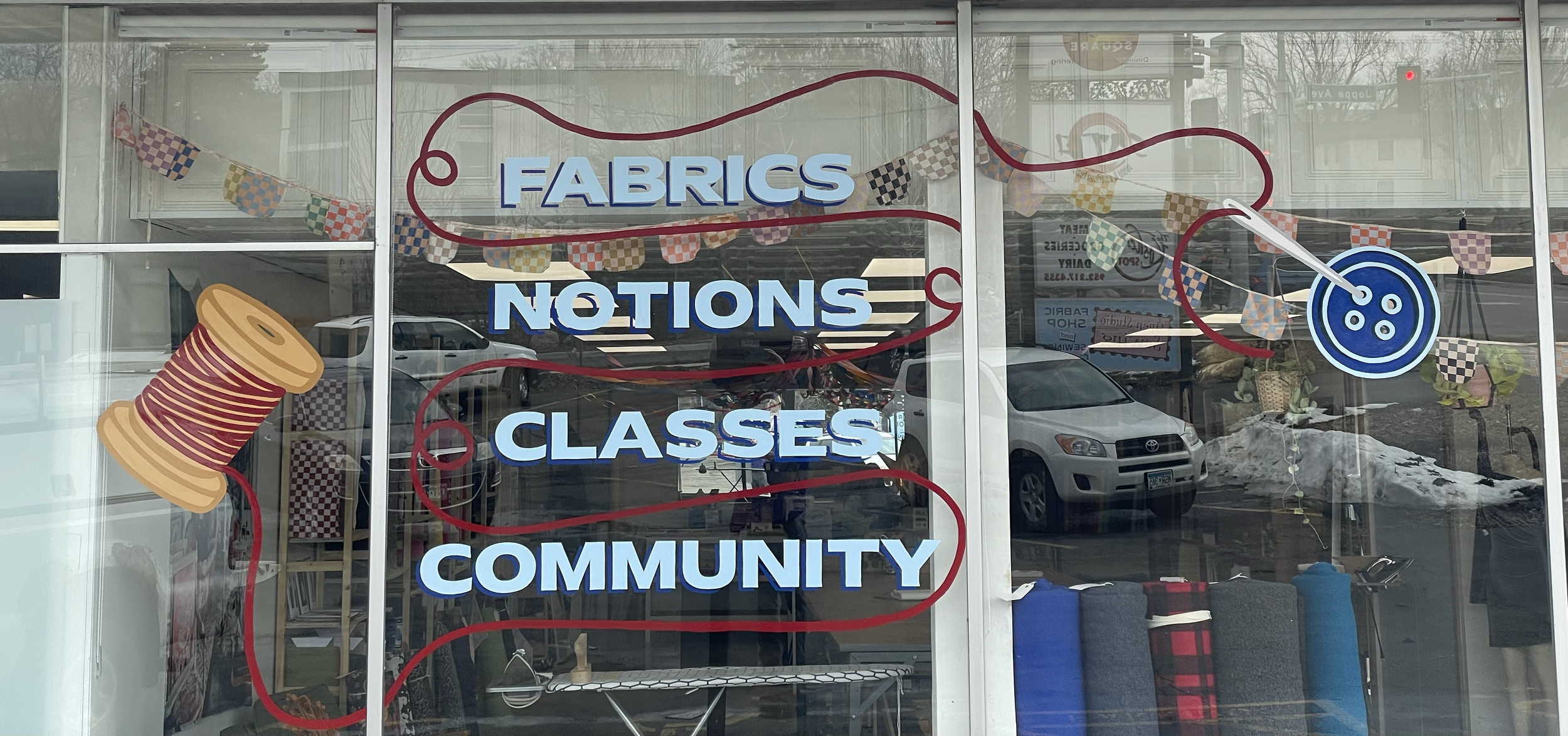 Hand painted window lettering and graphics for Open Sewing Studio