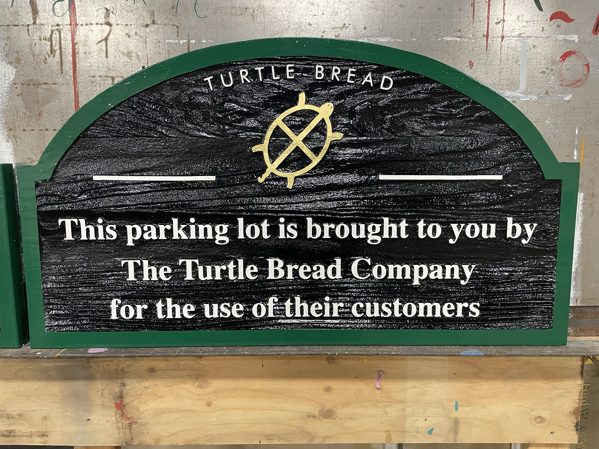 Sand blasted and painted sign for Turtle Bread with gold leaf turtle